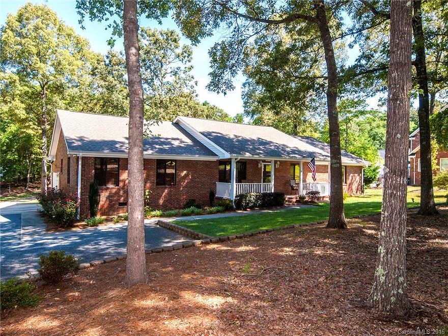 Hard to find single level pristine home, almost 2 acres. Nearly maintenance free. Full brick/vinyl trim, thermal windows, new paint, lighting,updated kitchen with stainless, granite counters & large island with bev fridge. Spacious owners suite, site finished hardwoods throughout, tile in all baths, 4 bedroom (1 used as office) open floorplan & all on one level. 2x6 framing and floored attic spans length of home. Tons of storage.  No HOA, bring all your toys. Mins to uptown, shopping & airport.