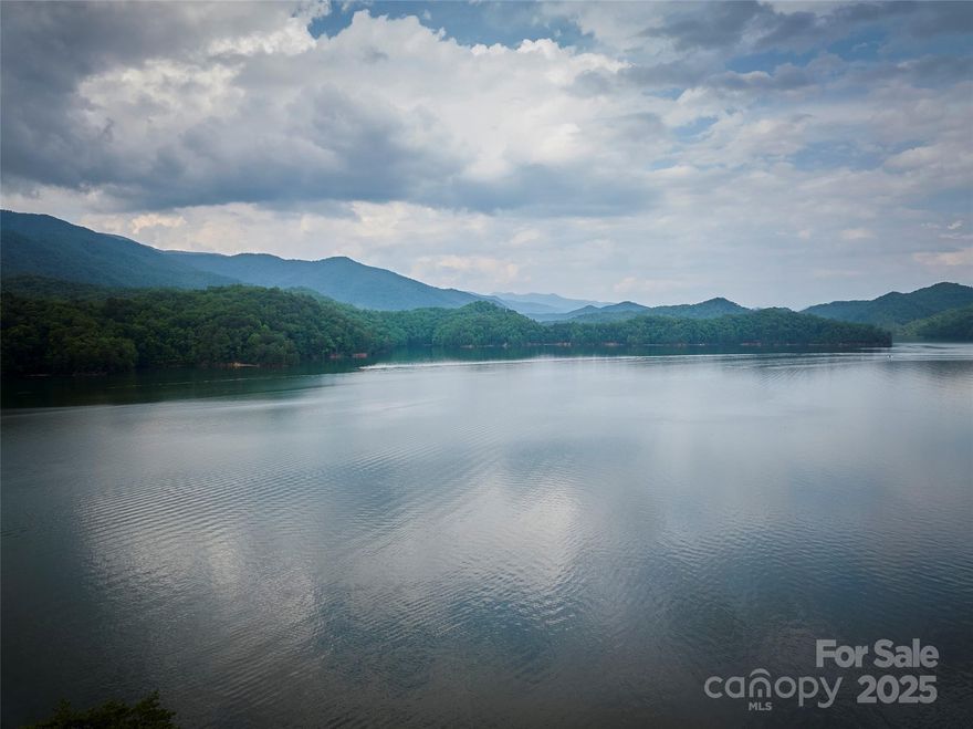 Discover your private oasis with this breathtaking lakefront lot, located in a serene gated development along the shores of Lake Fontana. Enjoy direct water access and unparalleled panoramic views of Fontana Lake and the majestic Great Smoky Mountains. Over 100,000 acres of U.S. Forest Service land surround this community, offering endless opportunities for fishing, hiking, hunting, and exploration. Tucked away from the hustle and bustle, this secluded retreat is perfect for those seeking tranquility and natural beauty without sacrificing luxury. Don’t miss this rare opportunity to own a slice of paradise—ideal for your dream home or vacation escape!