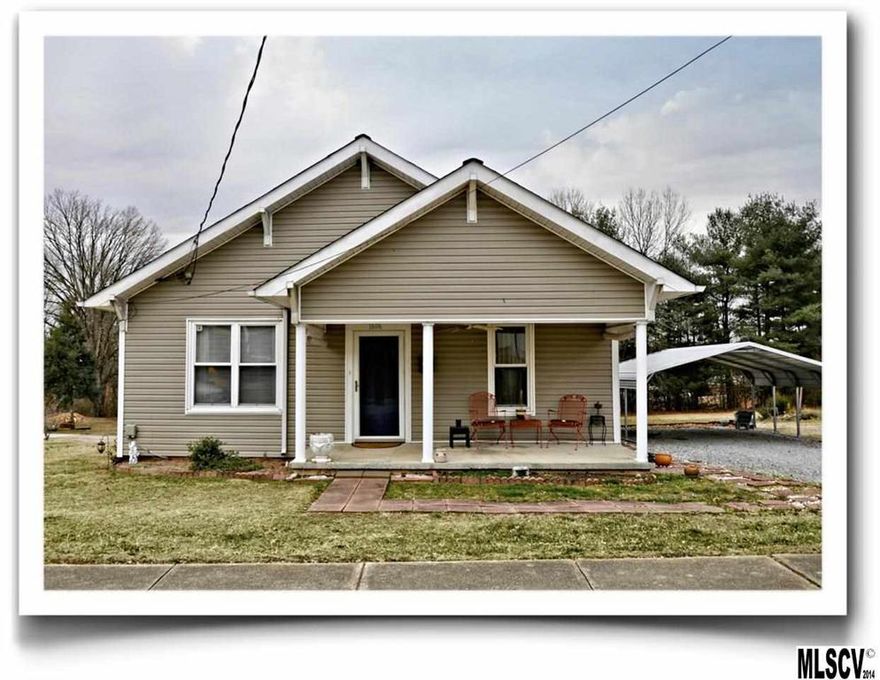 Charming home is move-in ready!  This home was updated in 2005 with new maple cabinets, appliances, laminate flooring and fixtures.  All windows were also replaced with low-maintenance, double-paned windows for energy efficiency.  Neutral decor features high ceilings and moldings for added charm.  The laundry room/storage closet allows for storage.  Eat-in kitchen includes the two year old stainless refrigerator and newer flat top range.  Two outbuildings for additional storage - one is wired for electricity.  Deck overlooks level backyard.