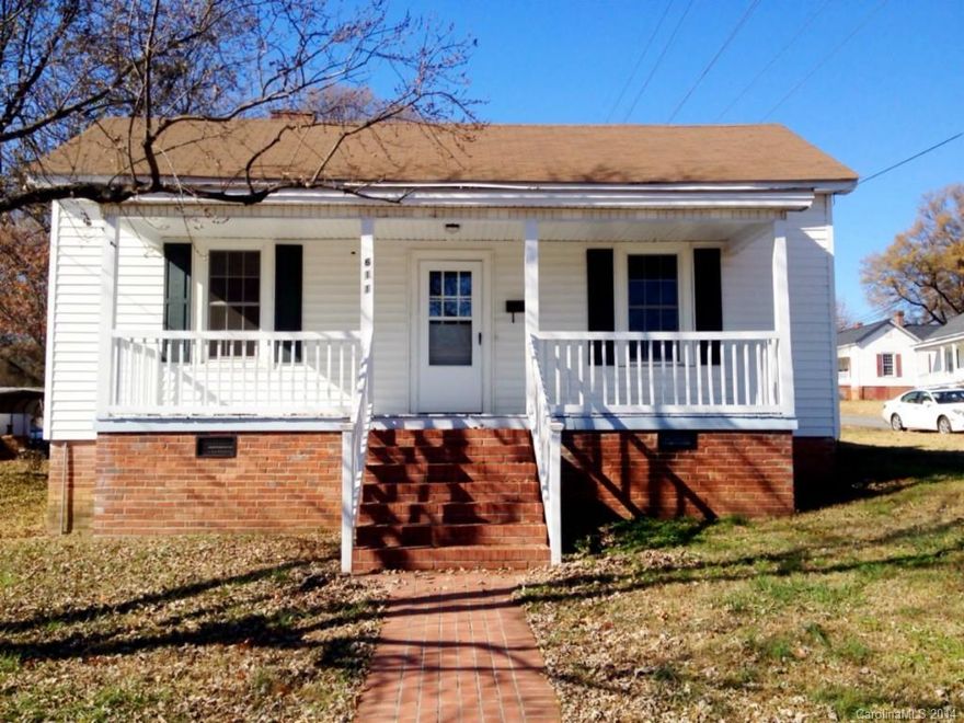 Great investment for that smart buyer that sees the potential in this location!  One block from NC Research Campus in Kannapolis, and zoned commercial.  Live, work, or lease out, and watch your investment grow.  Nice bungalow home/office recently updated. Spacious eat-in kitchen with butlers pantry. Renovated bathroom. Large bedrooms/offices. Vinyl Windows and Siding. Ideal corner lot with mature landscaping, inviting front porch and deck off of back.  One Year Worry Free Home Warranty Provided!