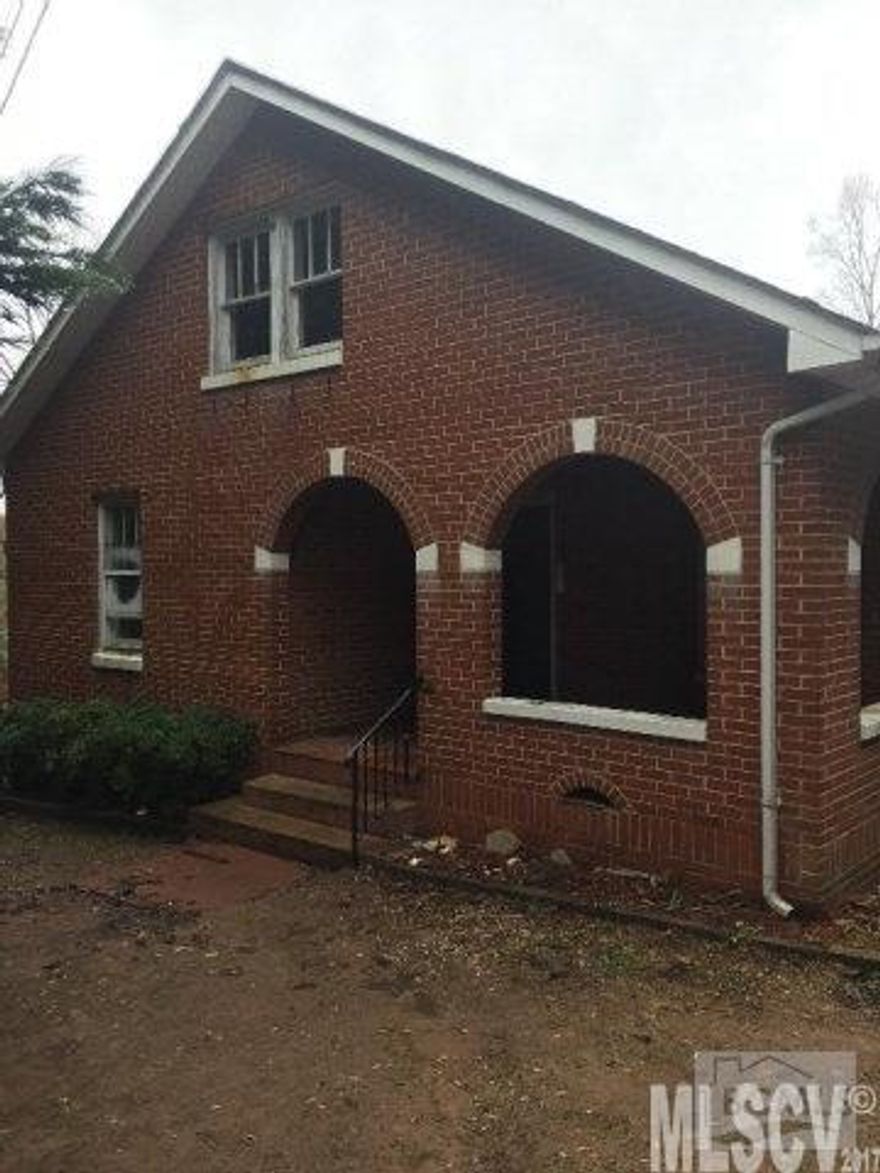 Good location just outside of the city limits of Valdese. Brick home with nice sized back yard. Interior has hardwood floors and good sized kitchen. Third bedroom is accessed through one bedroom which is common for a home this age. Upstairs has large room that could be used for additional bedroom or bonus room.Property would make great place for first time home buyer. Priced well under tax value.