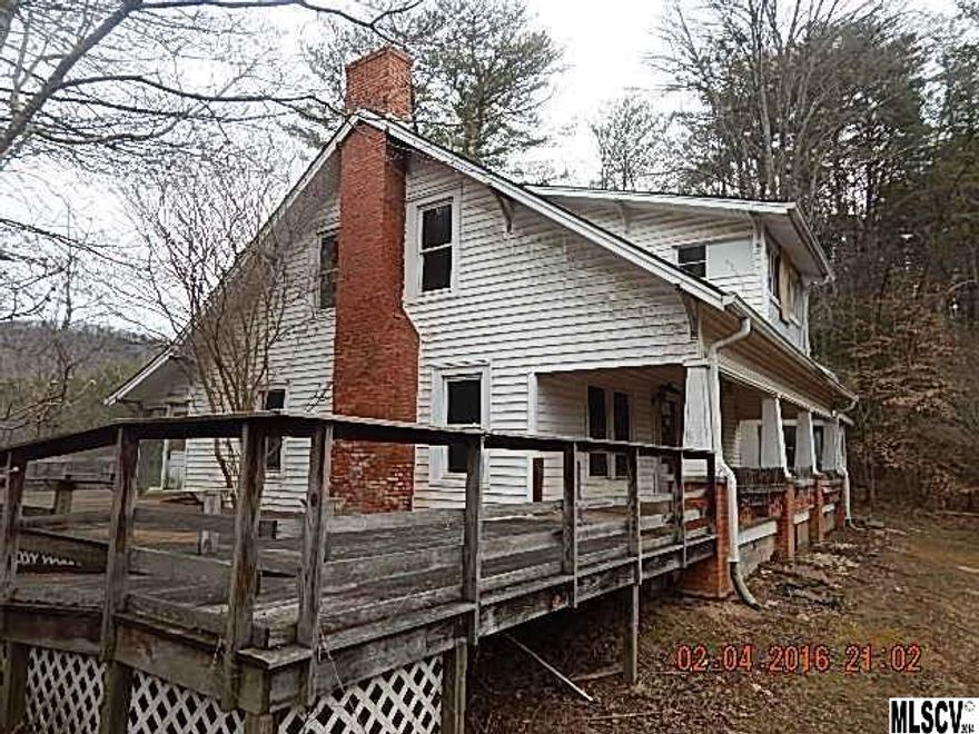 Older 2 br 2 ba Conventional style home on 11.54 acres with barn.  Additional home on property in need of repairs that could potentially be a rental.