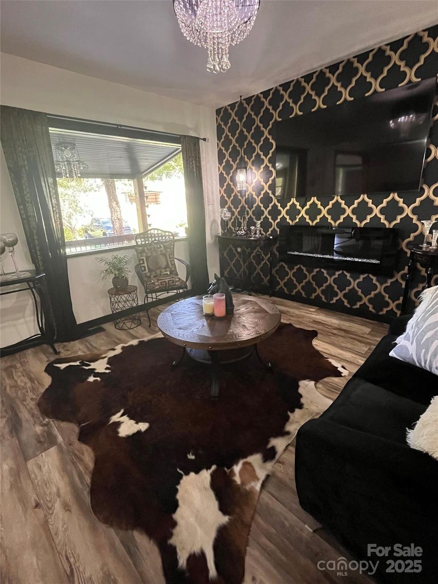 Come home to this cozy little hideaway in the Cowboy Capital of the East. Enjoy the many updates in this 2 bedroom, 2 bath unique home. Newly installed Pergo outlast flooring, new doors, faucets, outlets, switches and even some fandeliers adorn this space. The kitchen boasts porcelain tile walls and counter tops and Samsung's Bespoke Appliance suite ( 4 pc). The island in the kitchen is removable. A fenced in yard a plus! Bathroom has a new vanity top and toilet. The home is equipped with a Kwikset Halo Smartlock. A pasture is available for lease and has water and shelter. A large building big enough for 2 cars or a trailer is complete with shelving. It also has a 1/2 bath. An excellent place for a shop or whatever your vision is. Seller has scheduled septic to be pumped. Seller is offering a $1500. credit at closing to repair duct work.