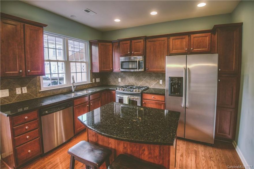 Immaculate End-Unit Baxter Village Townhome w/View of Lake Elliot! Gourmet Kitchen w/Granite, SS Appliances, and Tile Backsplash! Gleaming Hardwoods throughout main living area. Dual Master Bedrooms w/Tray Ceilings, Walk-in Closets, & Garden Tubs. Guest Suite/Office/Bonus Downstairs. Peaceful Location across from Nature Trails, Fountain & Lake only a Short Walk to Town Center! Top-Rated Elementary Schools, Shops & Restaurants, Miles of Walking & Biking Trails, Pools & Tennis; minutes from I77!