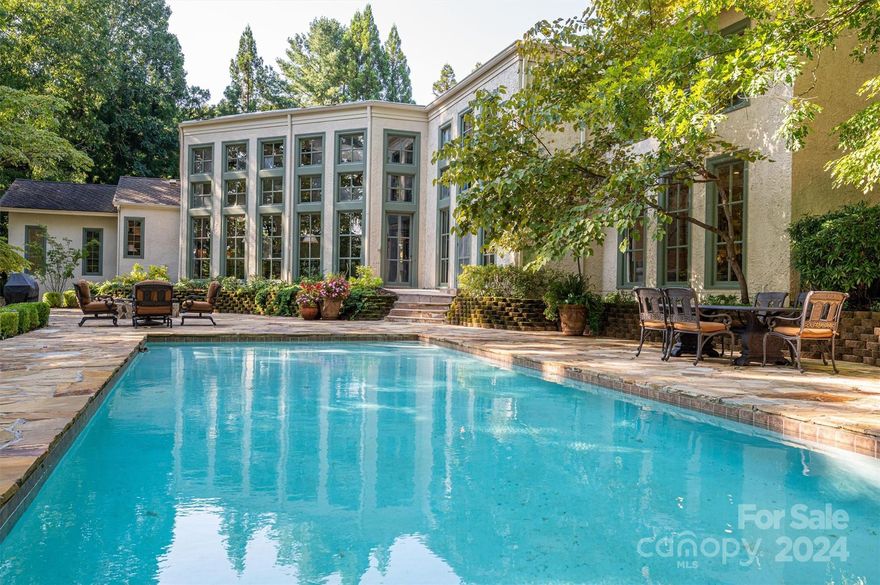 A HIDDEN GEM! Welcome to 179 Appian Way-a private, luxury, waterfront home on the best-kept secret in the region--Moss Lake! Located between Charlotte & Asheville, this 1660 acre recreational lake offers the best of lake living just 45 minutes from the CLT airport. Inside, find exquisite craftsmanship at every turn. The heart of the home is a great room w/ soaring 20' ceilings & windows overlooking the expansive outdoor living area & waterfront. Gunite pool w/ 3000 sq ft flagstone patio, fire pit, gently sloping path to dock, & extensive landscaping w/ irrigation. Main level primary suite w/ 2 separate baths & dressing rooms. Cozy den w/ fireplace & wet bar opens to a large kitchen w/ center island. Entertainment room includes full, wrap-around, seated wet bar & pool table. Three bedrooms, 2.5 baths, additional family room, office, & huge storage room upstairs. Two staircases. Enclosed patio. Large detached workshop w/ basement storage room for all your lake toys! A "must see" home!