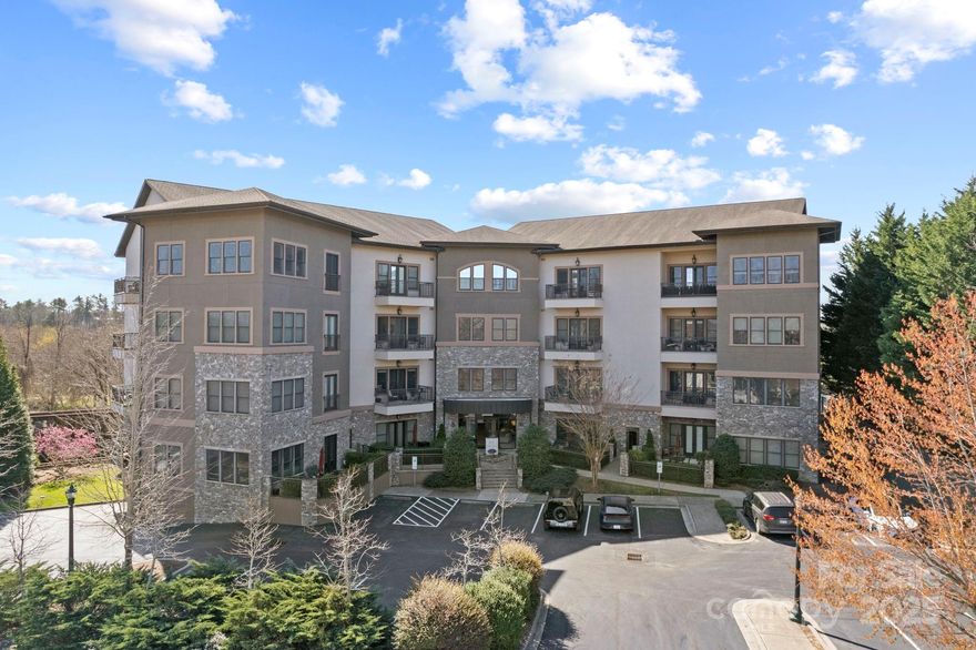 Stunning top floor and end unit condo in downtown Hendersonville with city and mountain views. This desirable location, Plaza In The Mountains,  is within walking distance to restaurants and shopping. Beautiful appointments throughout boasting high ceilings, crown molding, engineered hardwood floors, open floor plan, 8’ doors, living room with gas fireplace with glass stones, kitchen with granite countertops, under cabinet lighting, breakfast bar, stainless steel appliances with gas range, open dining area, primary suite with Juliet balcony, walk-in closet, double granite vanity, tub/shower combo, guest bedroom and bath. Relax and enjoy the views on the balcony. Amenities include fitness room, terrace with grill, assigned parking in garage. This exquisite downtown condo is ideal for full time living or a fantastic mountain getaway. This is truly a special place and a must see!