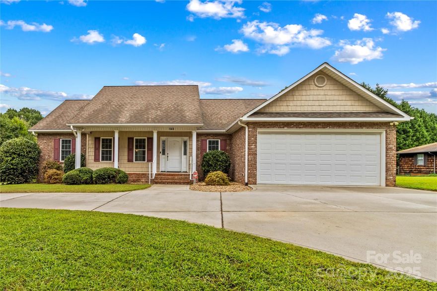 Beautifully maintained, one-owner custom brick home with thoughtful extras throughout. Conveniently travel to Mooresville, Hickory, and Charlotte. You’ll love an inviting split-bedroom floor plan, highlighted by gorgeous hardwood floors and abundant natural light. Exceptional craftsmanship in all the custom-built cabinetry, especially in the kitchen and primary bath. Handicap accessible doors—even for the closets. The kitchen is a chef’s delight, featuring soft-close drawers, granite countertops, an island, double ovens, and a stainless steel French door refrigerator. A propane gas log fireplace anchors the living room, with the smart TV above it remaining. Spacious primary bedroom features a large walk-in closet plus an ensuite bath with a walk-in tiled shower, large soaker tub, and double vanity. The true laundry room has storage cabinets which offer convenience. The garage provides ample parking space plus a ramp for handicap accessibility. Low-maintenance home with custom features.