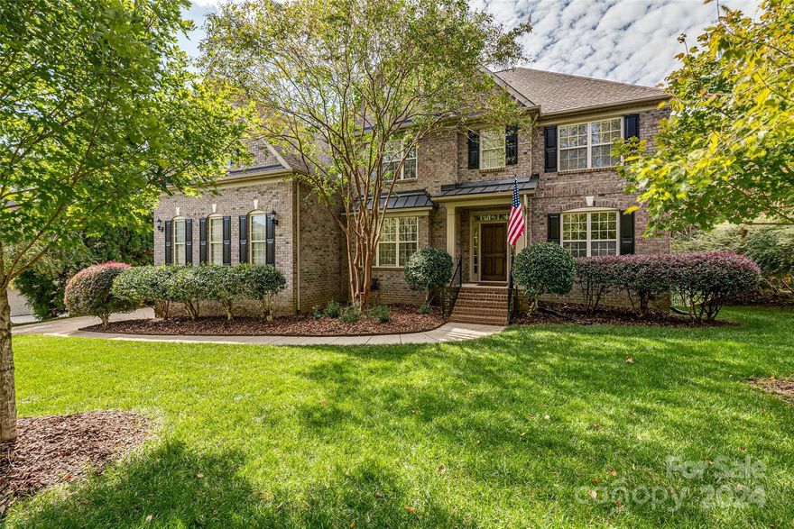 Beautiful full-brick James Custom Home on .38 acres in Ft Mill. This 4,000 SF home has everything you're looking for - Open floor plan, walls of windows that shower you in natural light, formal living and dining rooms, chefs kitchen, and beautiful hardwoods throughout main level. A flex room with full-bath is also on the main level and perfect as a guest bedroom or your home office. Dual staircases lead you up to the primary bedroom, 3 additional beds - each with en suite baths, a huge bonus room, and laundry room. Enjoy your favorite beverage or coffee on the 25' x 14' screened porch overlooking a peaceful and private back yard. Sellers also added a 12' x 14' deck for grilling. Back yard is fenced and has a paver patio w/ fire pit. 3-car garage side-load and has a 240V circuit for shop tools or EV Charger. Updates: HVAC 2019, 50-year roof 2019, tankless H20 heater 2023, dishwasher 2023, refrigerator 2024, DROP water monitoring system. Zoned Nation Ford HS, Ft Mill MS, Sugar Creek ES