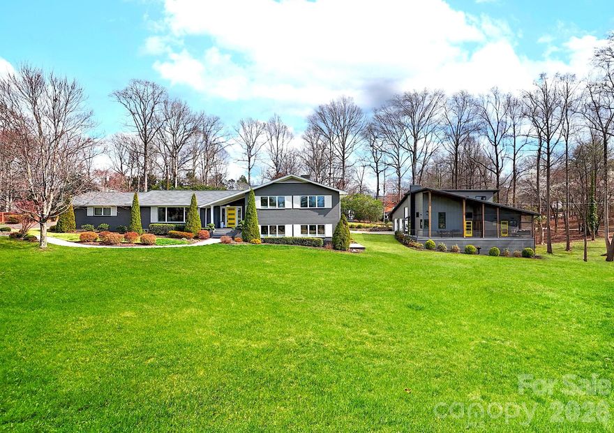 TWO individual luxury residences presented together to create one remarkable estate. Each home showcases its own architectural character and modern design. 438 Country Club Acres features a Main Residence PLUS Luxury ADU (Accessory Dwelling Unit)— a private 2 Home Estate designed for multi-generational living, guests, RVs, car collecting, or income potential. NO HOA. Perfectly positioned on 1.3 peaceful acres directly across from the fairway at Cleveland Country Club, this rare offering features an Impressive MODERN 4-bed/3-bath Main Residence PLUS Luxury ADU (Accessory Dwelling Unit) 3-Bay Bardominium (Built 2021). A fully self-contained 1-bedroom, 1-bath retreat with its own living area, kitchen, exquisite bathroom, laundry, private entrance & parking. Whether your passion is hosting extended family, RVs, car collecting, boats, equestrian trailer, motorcycles, workshop, gym or considering rental income, this space offers endless possibilities. Located only 50 minutes from Charlotte, this contemporary masterpiece has it all -- The Main home offers both Upper & Lower level Primary Suites. Every detail has been thoughtfully curated -- the light-filled open floor plan showcases modern style with white oak floors, designer lighting and new sliding doors to outdoor spaces. The sleek gourmet kitchen is the perfect gathering spot with large island, honed quartz countertops, glass tile backsplash, high-end appliances, double ovens and walk-in pantry. The Upper Level Primary suite boasts multiple closets and spa-inspired ensuite bath showcasing custom tile from Portugal, heated floors, soaring maple ceiling and custom lighted cabinets. Lower level offers an entertainment area with gas fireplace, bar and access to deck to enjoy the golf course view. 4th Bedroom has new FLOR carpet and large closet. Oversized laundry room has cabinetry, sink, and lots of room for additional appliances and storage. Exceptional craftsmanship at every turn: ALL Delta faucets and fixtures, SwissTrax flooring in main 2-car garage, sealed encapsulated crawl space, Central vacuum, and custom exterior shutters. The path to the Barndominium is surrounded by beauty and functionality with an additional 30Amp electrical hook-up for guests to recharge vehicles at the parking pad and a fully irrigated yard to keep the mature landscaping flourishing. The custom designed 2,600 sqft ADU (Accessory Dwelling Unit)/Barndominium greets you with Clopay garage doors: 1 RV-ready (10' x 14' tall) and 2 additional car bays. Metal construction with metal insulated interior walls keep garage at moderate temperatures. The RV-bay is fully equipped with RV hook-up: water, sewer, 50-Amp outlet & sink. Garage bays have linear drainage. Overhead loft provides additional storage. The gym has SwissTrax flooring AND split-system AC unit for comfort. The luxury ADU (Accessory Dwelling Unit)/Barndominium has zero-entry ADA doors/shower and contemporary design: vaulted ceilings, LV tile flooring, Zero-entry luxury bathroom. The oversized kitchen with honed leather quartz countertops, french door Monogram GE oven, induction cooktop, 2 drawer refrigerators and drawer microwave. Enjoy the wrap-around porch that overlooks the golf course. The outdoor shower and ventilated crawl space are more features of the practical luxury lifestyle you will enjoy at this estate property. Outdoor patio features a pergola with adjustable overhead louvers and firepit area perfect for entertaining. Luxury meets functionality at 438 Country Club Acres -- a property built for living well! NO HOA