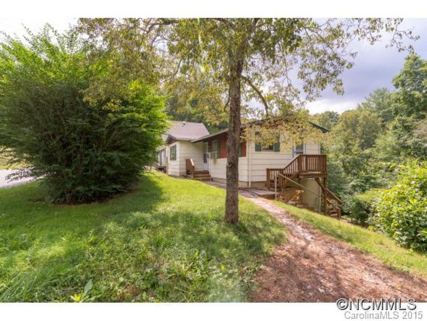 Unique property located in Black Mountain. Upstairs has 2BR/1 bath, living room, kitchen. Downstairs former apt with full bath. Large 1158sf detached garage with unfinished lower level and attic space. Property needs TLC but great investment opportunity. Home Inspection attached.  Zoning administrators comments attached. Bank must have list price.