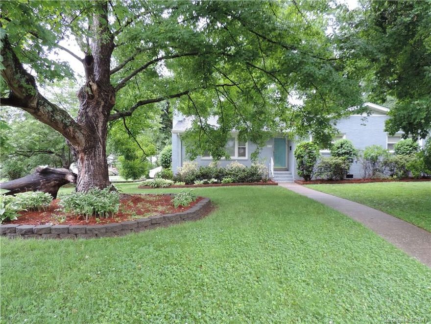 Immaculate brick home on a large corner lot! Stainless steel applicances, granite kitchen counter tops with center island. Beautiful wood flooring. Oversized walk in laundry room with washer and dryer included and built in shelving. Master bedroom with walk in closet. Living room has fire place. Small sun room for relaxing. Fenced in back yard. Great location.  Don't miss this stunning home. Must see!