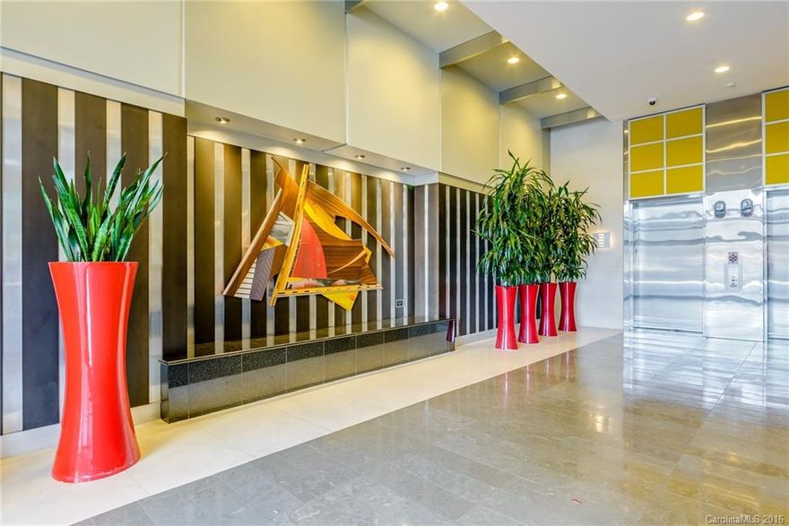 Motivated seller.   Luxury condominium with granite counter tops, stainless steel appliances, hardwood floors and dual vanities. Open floor plan features natural lighting with remote controlled automated shades in the great room and master.  This extraordinary location has unobstructed Mint Street views (Panthers Stadium, BB&T Field) One floor from the pool, workout center, community room and accessible to its garage parking space. Convenient to Uptown restaurants and other attractions.