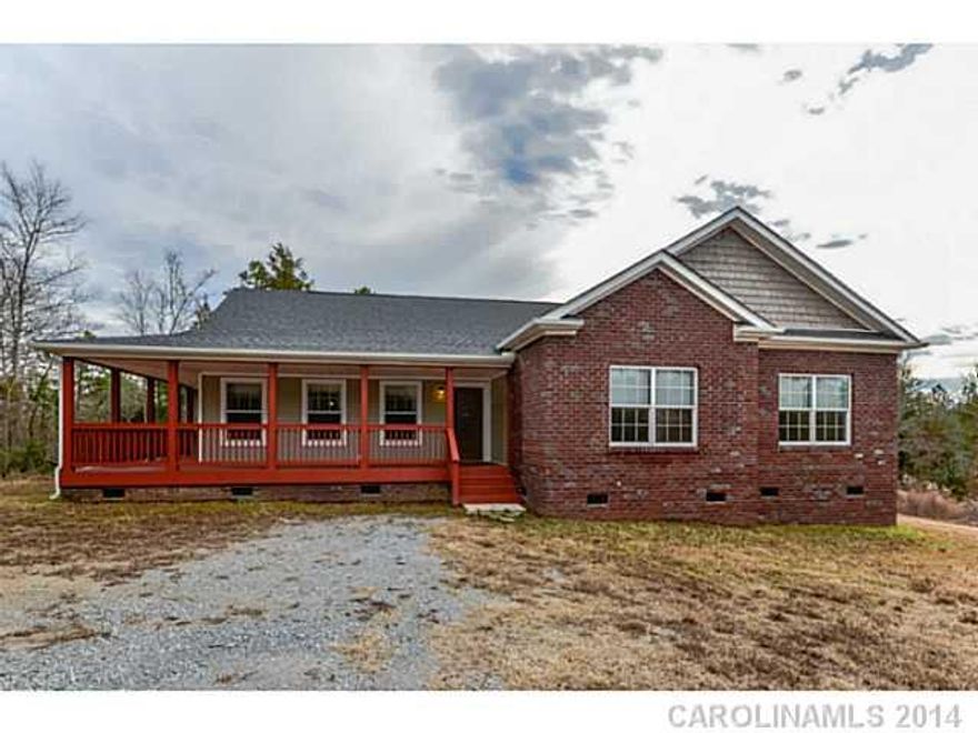 MOTIVATED SELLER! Owner to Pay $6000 Closing Costs!  USDA 100% Finance Available! No money down! All offers welcome!  New Model Home sits on 8.75 Acres in the Country w/Large Detached Bldg. This Custom Home has Front and Back Covered Porches that overlook the Natural Area. Large Eat-in Kitchen Offers Custom Features such as Cabinets, Tile, & Stainless. Oversize Custom Doors/Wide Halls and Large Master BR with His/Hers Sinks, Garden Tub and Separate Shower.