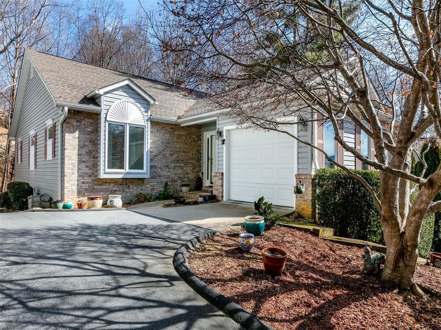 Come home to this wonderful cottage style home in highly desirable Cummings Cove, rated as one of the 50 best master-planned communities in the US!  This well kept home is move-in ready and has room to spread out.  The living/dining area on the main floor is bright and cheery, with a cozy gas fireplace, and leads out to the covered, screened deck.  There are 2 bedrooms and 2 full baths on the main level.  The basement level has a wonderful family room with another gas fireplace, an office area, a bedroom and full bath, along with another screened deck on the basement level.  The basement also offers a large unfinished space for storage.