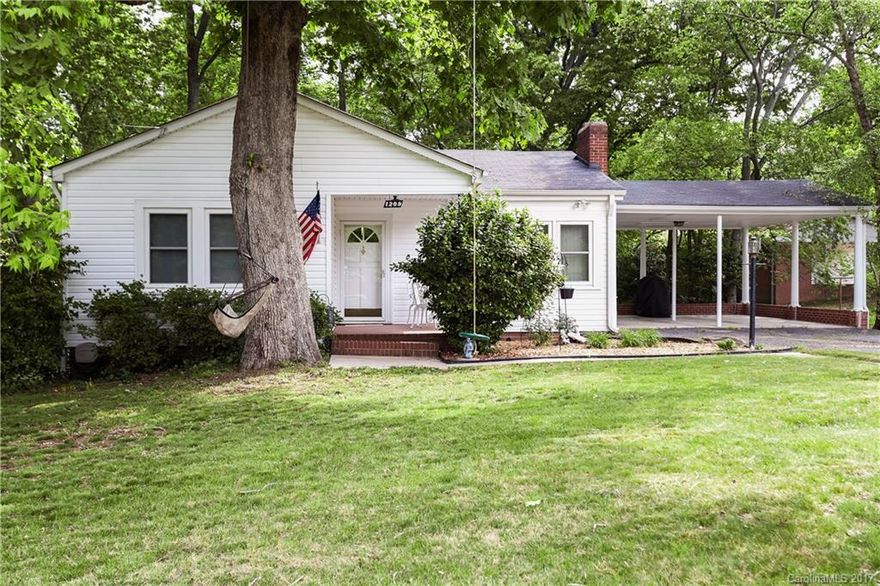 The cozy bungalow is cute as a button. Large Great Room with beautiful hardwood flooring, ceiling fan is the perfect place to relax and unwind.  Large Eat-in Kitchen and refrigerator stays!  Dining Room has beautiful hardwoods and could be a flex room / play room/ office or anything you wish.  Spacious Secondary Bedrooms all have hard wood flooring.  Private and quiet.  2 Car Carport.  Unfinished basement is perfect for a shop.  Beautiful trees.  Backyard perfect place for fire pit and more.