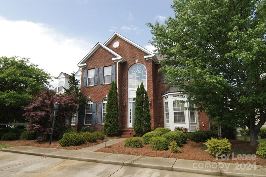This brick-front 4 bed, 2.5 bath home features many upgrades including hardwood floors. The floor plan includes a living room with columned entry & bay window and a formal dining room.  A fireplace framed by built-in bookcases accents the family room. The eat-in kitchen features a tiered breakfast bar, all major appliances & breakfast area. The upper level primary bedroom boasts a tray ceiling, an en-suite bath w/dual sink vanity, soaking tub & stall shower. Bonus room can be used as flex space.  The former garage has been converted into an office/den. Relax & entertain on the deck or take advantage of the community pool, playground, clubhouse, recreation area and tennis courts! Local conveniences are just around the corner! Minutes to shops and dining at Rivergate. Only a short drive to all the excitement at Carolina Place Mall and the Ballantyne area. Love Lake Wylie? Enjoy hours of recreation on and off the lake at McDowell Nature Preserve. Close to I-77 for easy access to Charlotte