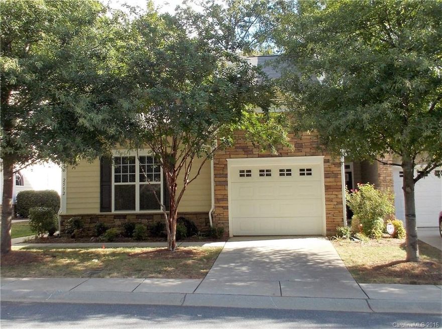 Charming "Craftsman" style, end unit town home is desirable Cobblestone. Large open living area with vaulted and 10' Ceilings. Hardwood floors, granite in kitchen, 41" cabinets plus gas range. Large bedrooms with newer carpet, 2 baths with ceramic tile, home office with built in desk, large laundry room. Gas log fireplace in family room, private, wooded rear lawn. Move in ready in the heart of Indian Land. Walk to shopping, dining entertainment. 8 miles to Ballantyne.