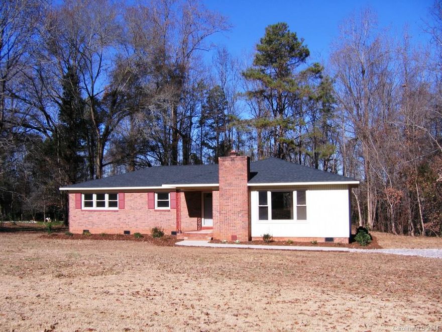 INDIAN LAND SCHOOLS!! Completely remodeled. New heating and air, new roof, new floor covering, new appliances, granite countertops, new tubs, new sinks & plumbing fixtures, new light fixtures, new deck. Outstanding home on nearly an acre of land. The large Great Room has a REAL wood burning fireplace. Formal Dining Room. Feels like a brand new home. Live in the country yet close to town and shopping. The wooded homesite is great for pets & outdoor activities. Low property taxes!! Great schools!!