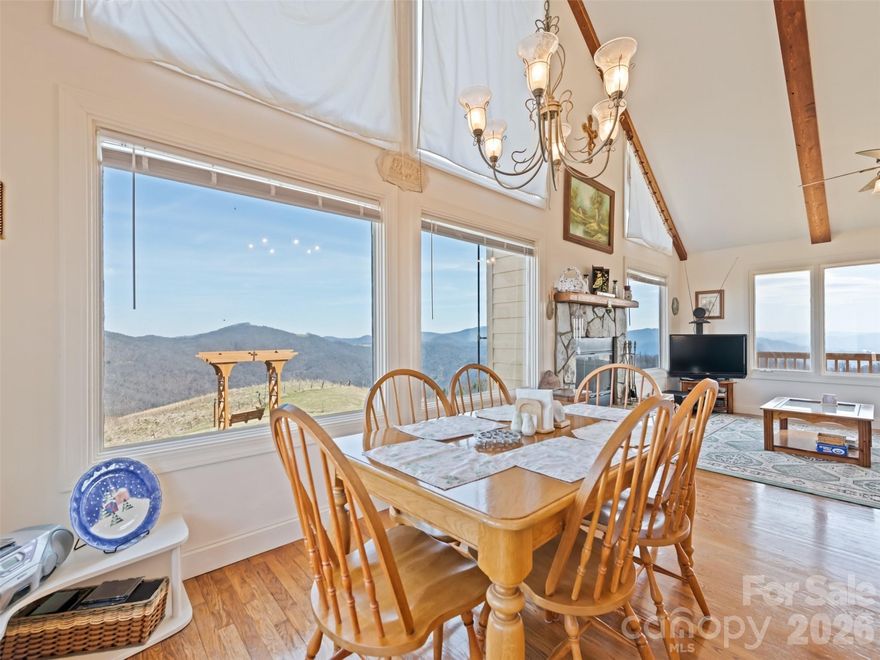 Stunning long-range views in every direction make this 30-acre mountain retreat feel like you’re on top of the world. Indescribable sunrises and sunsets. Mostly cleared and gently rolling, the property offers two additional excellent home sites, providing exceptional flexibility for expansion, guest homes, or investment opportunities. Elevations range from 4,100 to 4,500 feet, delivering cool mountain breezes, peaceful privacy, and abundant wildlife—where hawks soar and nature surrounds you. ***The impeccably maintained main home features recently painted cedar siding and a 2025 roof, blending mountain charm with thoughtful updates. Inside, the main-level living area centers around a dramatic two-story great room with walls of windows, hardwood floors, and a stone-faced wood-burning fireplace. The open kitchen includes an island, breakfast bar, and dining area—perfect for entertaining while enjoying the breathtaking views. The main level also offers two bedrooms, two baths, and laundry, making everyday living convenient and comfortable. ***Step outside onto the wraparound deck or climb to the unique crow’s nest landing for even more spectacular scenery and perfectly private silence. This home truly brings the outdoors in, with views from nearly every room. ***The lower level features a private apartment with both interior and exterior entrances, kitchenette, and Quadra-Fire wood stove, ideal for guests, or multi-generational living. Additional features include: all furniture, a 26-foot-long one-car garage with space for a vehicle and mower, attic access with steps and lighting for extra storage, and propane lines already in place for the range and fireplace, with an owned 500-gallon propane tank. HOA: road maintenance only as needed ($100 in 2025).