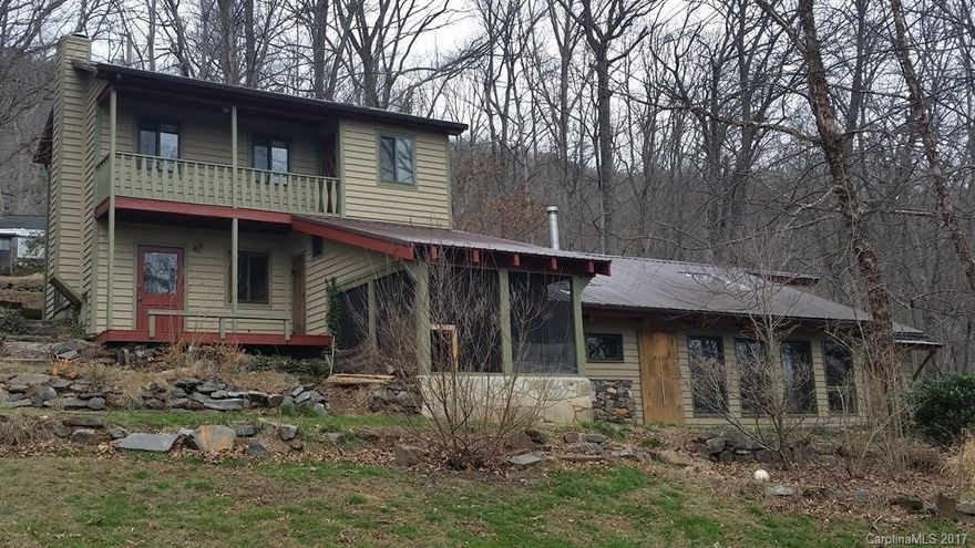 Unique contemporary home on 6+ acres with year-round mountain views. Quiet country feel yet just minutes to I-26 and Asheville. Features include bright/open/split-bedroom floorplan, vaulted ceilings, brick floors, large outbuilding, and pasture. Ready for new owners to spruce-up and make their own! Buyers should verify all MLS data for accuracy as Seller/Listing Agency make no representations. $100/yr road maintenance fee. **Offer deadline is 6/29/17 at 5pm EST**