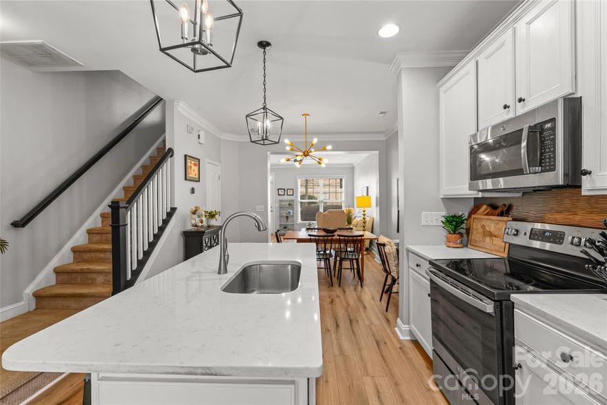 SECOND CHANCE OPPORTUNITY! Tucked into the heart of Historic Wesley Heights, this modern 2-bedroom, 2.5-bath townhome truly has it all. The main level welcomes you with new honey oak luxury vinyl flooring, fresh neutral paint, and an abundance of natural light. The renovated kitchen shines with white quartz countertops, crisp white cabinetry, updated fixtures and functional island ideal for gathering or enjoying a quick meal.

The upper level showcases a private guest suite including an updated vanity, hallway access to a conveniently located laundry closet, and a spacious primary retreat with vaulted ceilings, a custom walk-in closet system, and a refreshed bath highlighted by a granite double vanity.

Step outside to a fully fenced backyard with low maintenance patio pavers that boarder secluded woods—perfect for relaxing and entertaining. Neighborhood access to the Stewart Creek Greenway - a direct route to the Panther’s Stadium. Walking distance to Rhino Market, Town Brewing, Not Just Coffee and an array of other vibrant dining, shopping, and neighborhood favorites. With mature trees, Charleston style neighborhood charm, and quick access to Uptown, South End, and Charlotte Douglas International Airport, this townhome checks every box for connected, low-maintenance living.

Main level flooring 2026, HVAC 2025, Furnace 2023, Roof 2025 Water Heater 2019. Previous buyer’s preferences changed. No inspection concerns and appraised over list price.