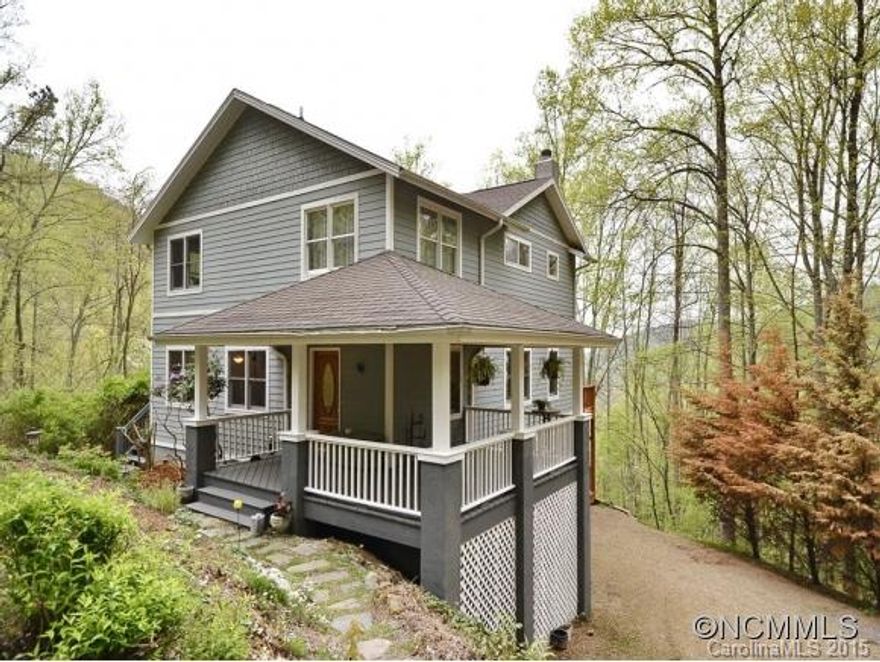 Quality home nestled between million dollar homes for half the price. Peace and privacy but only minutes to Merrimon and downtown. Open floor plan makes for great entertaining with a vaulted ceiling in the living room and fire place. Hard woods throughout first and second floor with tiled kitchen and baths. Cozy lower level offers nine foot ceilings, gas wood stove and walk out daylight. Two large decks to enjoy your piece of heaven.