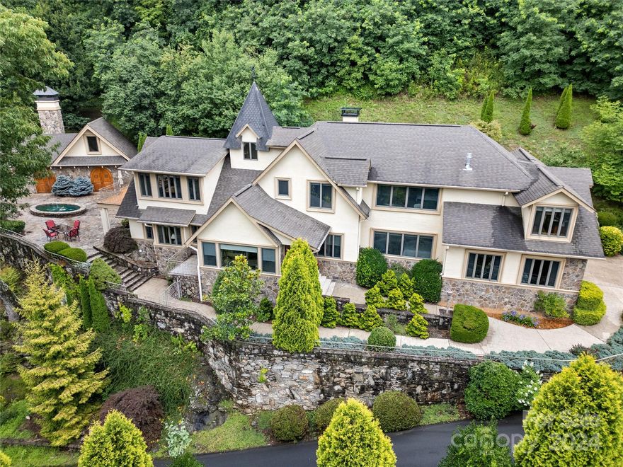 This Mediterranean-style executive home in Smoky Mountain Sanctuary offers a rare blend of luxury, privacy, and natural beauty. Nestled within a gated community, the property boasts long-range views and is designed for both lavish entertaining and comfortable living. Craftsmanship shines throughout the home. The spacious patio, complete with an outdoor kitchen w/fireplace is ideal for hosting gatherings. Designed for easy upkeep, the property features low-maintenance grounds, allowing you to enjoy the surroundings without extensive maintenance. Conveniently located near Waynesville, the home provides easy access to the Waynesville Inn & Golf Club, and all local amenities while still offering a tranquil retreat. For culinary enthusiasts, the kitchen is a standout feature, promising to impress with its design and functionality. Both the master suite and the den feature fireplaces, and the 2 Bonus rooms provide ample space for guests and family alike. SF is approximate pending measurement