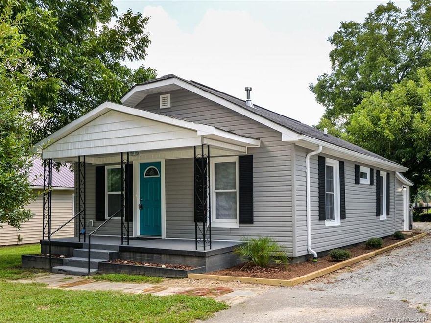 Completely renovated mill house in Kannapolis!! Home features 16 ft vaulted ceilings, sky lights, instant hot on-demand hot water system, newly tiled bathroom walls and floor. New windows, doors, insulation, house wrap, siding, trim and gutters. The original hardwood floors  have been refinished and new carpeted installed in bedrooms.  The large lot offers enough room to add a garage! New wiring throughout and new plumbing from the meter inside and back to the street.