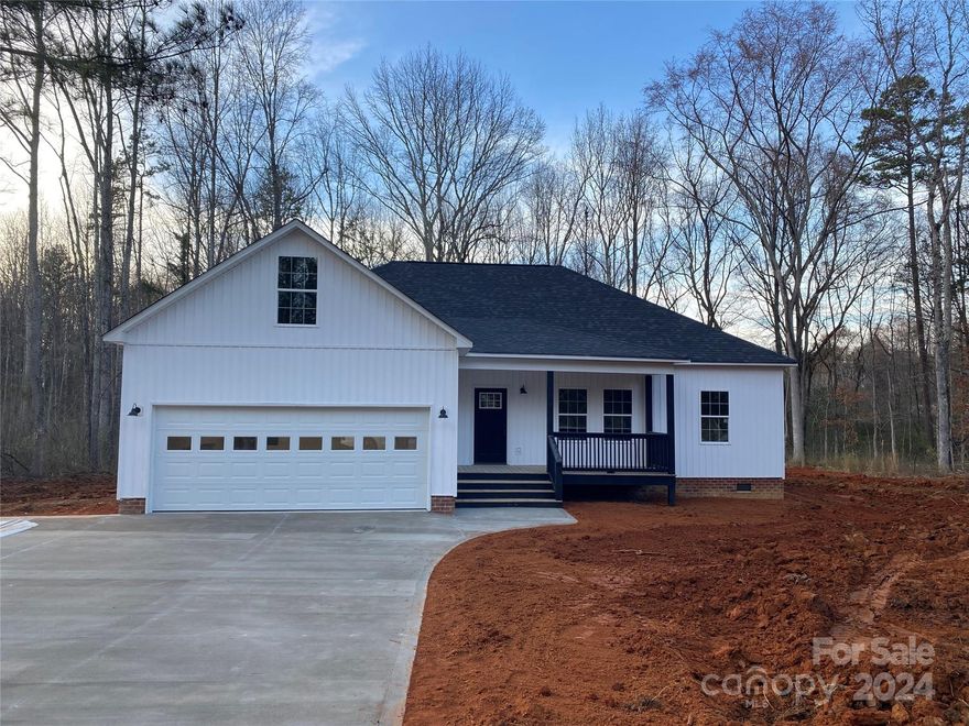 New Construction in a country setting, but less that 5 minutes from shopping and schools.  Split 3 bedroom floor plan with 2 full baths, granite countertops and vinyl plank flooring throughout.  Enjoy the views from either the front or rear covered porches.  Attached garage, concrete drive along with a private well & septic -  all on a 1 acre lot that offers room to roam! New Well installed, well depth 165' casing depth 38' puts out 25 gallons per min. Broker/Owner.