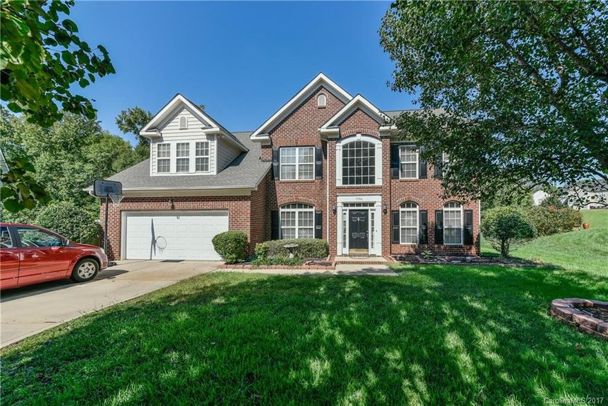 Price improvement to sell fast ! Brick front home with 5BRs located on one acre cul-de-sac lot that backs to trees and offers great pond views.  Guest BR on main level.  Huge kitchen has large island ready for bar stools, built-in desk & sunny breakfast area.  Living room would make great office.  4BRs up plus back stair case leads to bonus room.  Huge flat backyard is fenced.