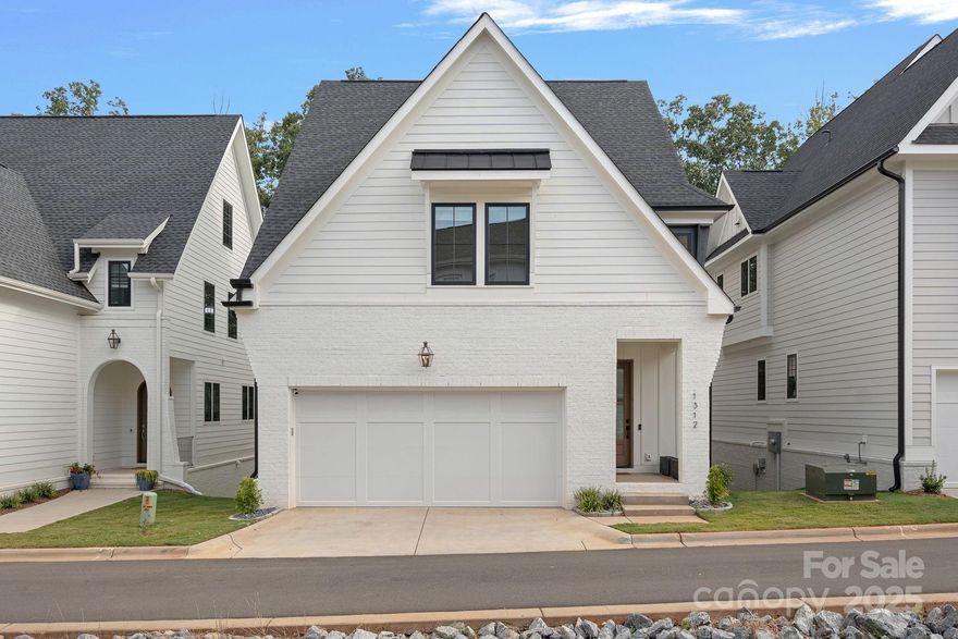 Nestled in The Cove at Davidson Bay and built in 2023; this unique residence offers modern construction benefits and is situated along a natural cove on Lake Davidson, merely a mile from Downtown Davidson and the newly built Beaty Park. The community boasts a waterfront common area with kayak and paddleboard storage, a launch site, scenic walking trails, and ample parking. The open-concept main level features a gourmet kitchen equipped with Thermador appliances, a spacious island with additional storage and seating, and a breakfast nook overlooking the cove. The living room opens to a deck—perfect for lakefront barbecues.  With 4 bedrooms, 3.5 bathrooms, multiple living areas, and a wet bar, this home provides abundant space for relaxation and entertainment. Designed with future convenience in mind, it's also elevator-ready. Landscaping is included in the HOA! Embrace the best of lakefront living and the vibrant community of Davidson in this exceptional property.