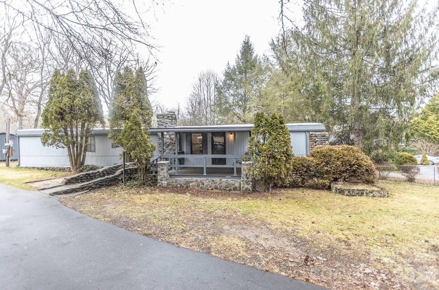 Fully Furnished Vacation Home AirBnB in Downtown Black Mountain

Thoughtfully renovated manufactured home with keyless entry is move-in-ready! Fully stocked kitchen, all appliances, furnishings, and W/D included. The primary "queen" bedroom connects to the full bath, while the second "full" bedroom has its own private half-bath. A cozy third bedroom features twin bunks—perfect for little ones.

The living area centers around a decorative fireplace, dining room table, and separate office nook. Sip your morning coffee from the rocking chair front porch, then enjoy the back deck around the fire pit and propane grill for a relaxing evening. Central heat and 4 window AC units keep things comfortable and cost-effective during our mild mountain summers.


The private, fenced lot and driveway has room for 3 cars and is just a half-mile to vibrant downtown Black Mountain and 2 miles to charming, historic Montreat. This rare, affordably priced gem awaits you in WNC's most sought-after market.