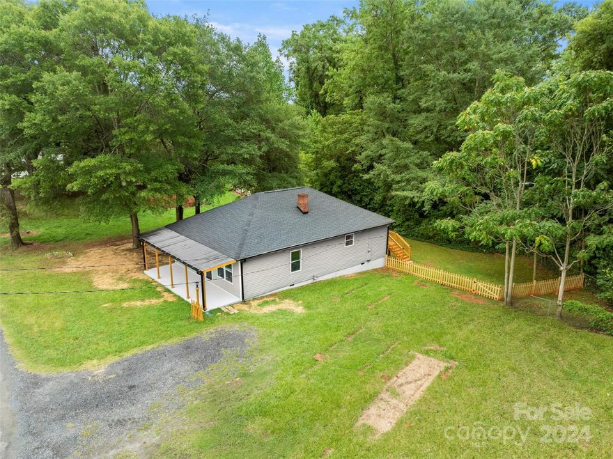 This house was gutted. Please see list of work completed. Owner/Broker spent $80,000 on the following: New Kitchen with Granite Countertops, New Cabinets, New Vinyl Plank Flooring, Plumbing and Plumbing Fixtures, Electrical and New Lighting, All new Sheetrock including Ceilings, New Wood Deck, New Covered Porch, New Craftsman Doors, New Barn Doors, New Kitchen Appliances, New Bathroom including Tub, Tile, New Bathroom Vanity, New Custom Shelving throughout the house and closets, New Insulation in Attic and Crawl Space, New Vinyl Liner in Crawl Space, New Water Heater.  House is attached to Belmont Central Belmont Middle, South Point High School. Great Location off Wilkinson Boulevard. 3 Bedroom and 1 Bathroom. Island in Kitchen with Seating Area. UPDATE: PER PREVIOUS OWNER, A NEW SEPTIC LINE WAS INSTALLED EARLY 2024. ALSO, THE TANK WAS PUMPED.