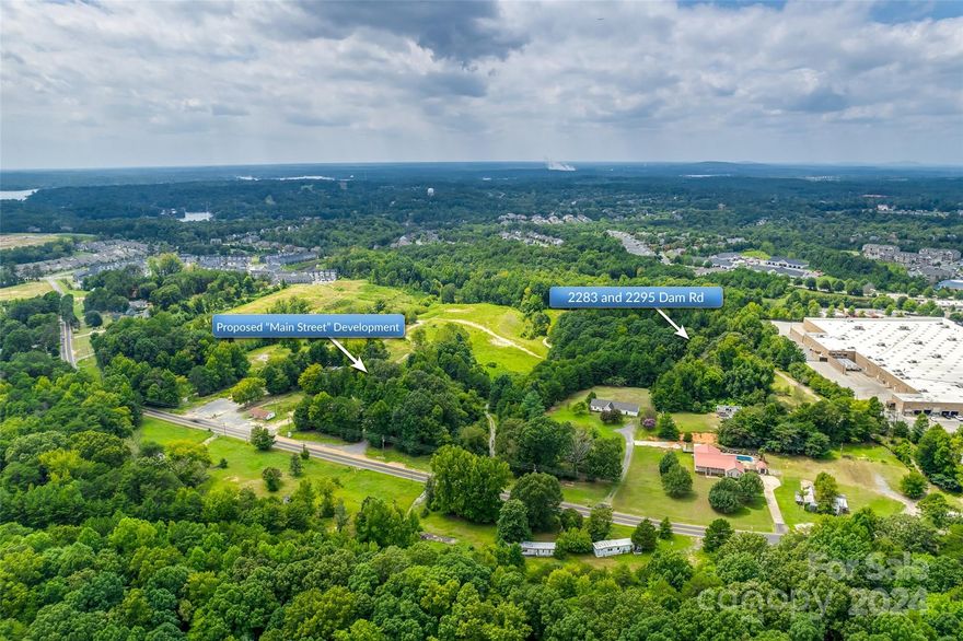 Rare opportunity for developers and investors! Two parcels (644-000-0039 and 644-000-0016) make up a total of 10 +/- acres. This property is adjacent to the proposed Tega Cay "Main Street" development and also runs parallel to Walmart in the Stonecrest Shopping Center. The property is roughly half a block off Hwy 160 on Dam Rd and has approximately 630 feet of road frontage. Currently zoned RUD and will require rezoning for highest and best use. Property will need to be annexed to Tega Cay since water and sewer services provided by the City of Tega Cay. Two dwellings and miscellaneous buildings will convey as is and at no value. The property is also advertised for sale in the commercial section of Canopy MLS #4173897. Buyer responsible for land test, survey, and rollback taxes if any. Buyer agent should verify any important information.