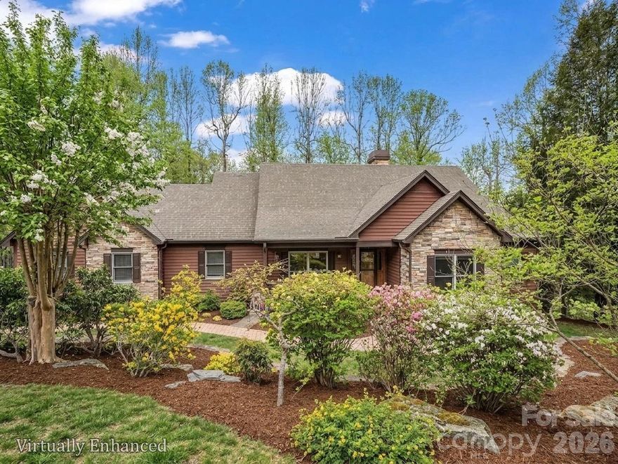 Stunning, well-appointed, pristine home situated in one of the best kept secrets in Hendersonville, Pathways of Solomon Jones, a small enclave of luxury mountain homes within close proximity to Hendersonville and Flat Rock! Pathways of Solomon Jones strives to keep the natural state surrounding its current 43 homes intact, with each having 2 to 5 acres of land, protecting the privacy of its homeowners. This meticulously maintained, 3 bedroom, 3 bath home is set on over 2 acres and is the perfect in size for those wishing to age in place yet have room for family and friends to stay awhile. The main living area has a beautiful, vaulted, beamed ceiling, built in bookcases, and a dramatic, soaring fireplace for cold winter nights. Warm oak floors and new wood doors throughout the main level create that mountain ambiance so many desire. Light streams through its many windows and doors which lead to the large deck with winter views. The gourmet kitchen, featuring high quality cabinetry, leathered granite countertops, double ovens and a walk-in pantry, flows seamlessly into the dining and living rooms making it ideal for everyday living or entertaining. The primary bedroom provides access to the deck as well to take in the surrounding beauty and has an ensuite bathroom with a double leather granite countered vanity, separate shower and garden tub.  The guest bedroom on the main floor could be used as a bedroom or an office, with private access to the second full bathroom, also accessible as a hall bath. The laundry room is also on the main level and offers a sink and pull-down ironing board! Every window beckons one to spend time basking in the magnificent landscaping all around the home with limited grass to maintain. The lower level offers a family room with built-ins for setting up a home office or enjoying a movie. The French Door from the family room provides access to the flagstone patio and paths meandering through the beautifully landscaped flower beds. An additional bedroom, full bath and second bonus room for whatever your heart desires, provide a private oasis for family and friends.  An unheated fitness room is also available for staying in shape from home. And there is plenty of additional unfinished space for one wishing to expand. For those desiring to have access to amenities, guest memberships are available through the Champion Hills and Hendersonville Country Club. A mere 5 minutes down the road is Champion Hills, known for its award-winning Fazio Golf Course, ranked 47th in the US on Golfweek’s 2026 list. Members also enjoy a wellness center, pool, tennis, pickleball, walking trails and upscale and casual dining available through Champion Hills. Hendersonville Country Club is also less than 15 minutes away and offers golf, tennis, pickleball, a pool, fitness center and dining for its members. The charming town of Flat Rock is 17 minutes away. Downtown Hendersonville, just 15 minutes away, was touted by the New York Times as the “City of Four Seasons,” sits on the edge of the Blue Ridge Mountains. It is home to over 200 apple growers with close proximity to world class hiking and bike trails and is known as a quaint, family-friendly town! It was named “Best Retirement Town” in 2023 and continues to attract newcomers both young and old. Hendersonville also offers a variety of medical care options including three hospitals: Advent Health, Pardee Hospital and South Asheville ER. Come and see this home and experience what it feels like to be on vacation all year long! The best way to get to the house is to GPS to One Hagen Drive and then this address. Video link:
https://youtu.be/qQUPZg5AEaE?si=6SpSHt_rp1MbORto
