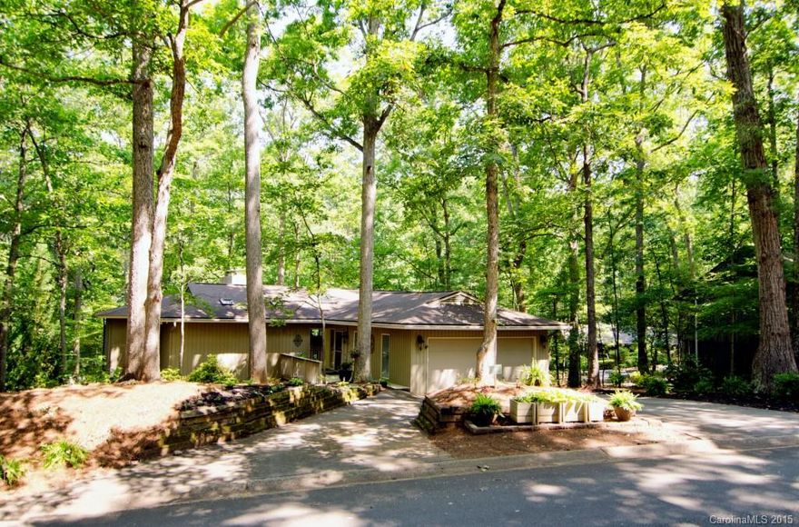 Entertaining is a breeze with this open design! You will be delighted from the moment you enter with the unique floor plan this home has to offer. Beautifully maintained with updated kitchen and bathrooms.  Huge master on the main with romantic fireplace! Extensive decking upper and lower. Mature trees in fenced back yard.  Enjoy all the amenities that River Hills has to offer...24 hour security, walking trails, children's playground, waterfront park!  Don't miss it!