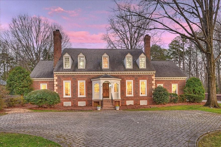 Exceptional opportunity in Berkeley Grove - beautiful enclave of custom designed homes nestled in the heart of SouthPark! Prestigious Estate modeled after Gunston Hall on large 1.37 acre lot. Wonderful natural light, hardwood flooring and floor plan. Home features elevator, four fireplaces, extensive moldings, custom staircase runner and new carpet upstairs! Primary Bedroom on main level with fireplace, two full bathrooms and walk-in closets. Two story Great Rm w/floor to ceiling windows. Formal Dining Rm & Living Rm both with fireplaces. Spacious Kitchen w/breakfast area & Wet Bar. Laundry rm w/utility sink. Three secondary bedrms upstairs, two full bathrms plus large Bonus rm w/attic storage. Attached two car garage plus detached two car garage w/half bathroom & permanent stairs to 752 sqft unfinished space. Expansive paver driveway w/ample parking. Amazing flat and private backyard! Located on private paver road behind brick wall across from Country Day and backs up to Carmel Park.