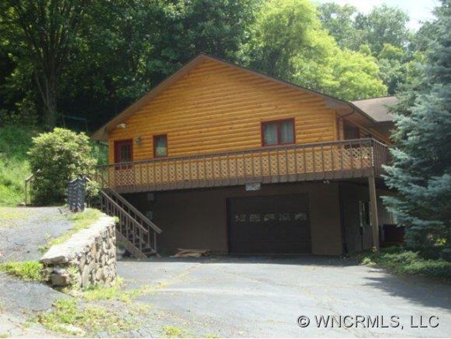 Great home with the most spectacular mountain views.  Main living area has open great room with kitchen and dining;  Split bedroom floor plan; vaulted ceilings; stone fireplace, large utility room; wrap around porch.  Downstairs has great rec room, bonus room with 1/2 bath, garage.  Home is currently a vacation rental with owner.  Home is being sold completely furnished.  Home has brand new roof...installed Aug. 2014