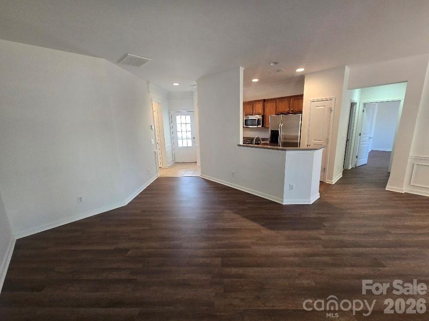 This townhome has it all and is move in ready.  It is nestled on a quiet street in the desirable 55+ Active Adult Community of Sun City. The best price around.  Great floorplan with a large kitchen.  Freshly painted interior.  New Water-proof LVP flooring.  Stainless steel appliances that are all included. This home has been very well maintained.  Large 2 car garage.  Enjoy low-maintenance living and resort-style amenities to include an 18-hole golf course, walking trails, indoor and outdoor swimming pools, dog park, wood working shop, tennis courts, and much more in amenities-rich Sun City Carolina Lakes!