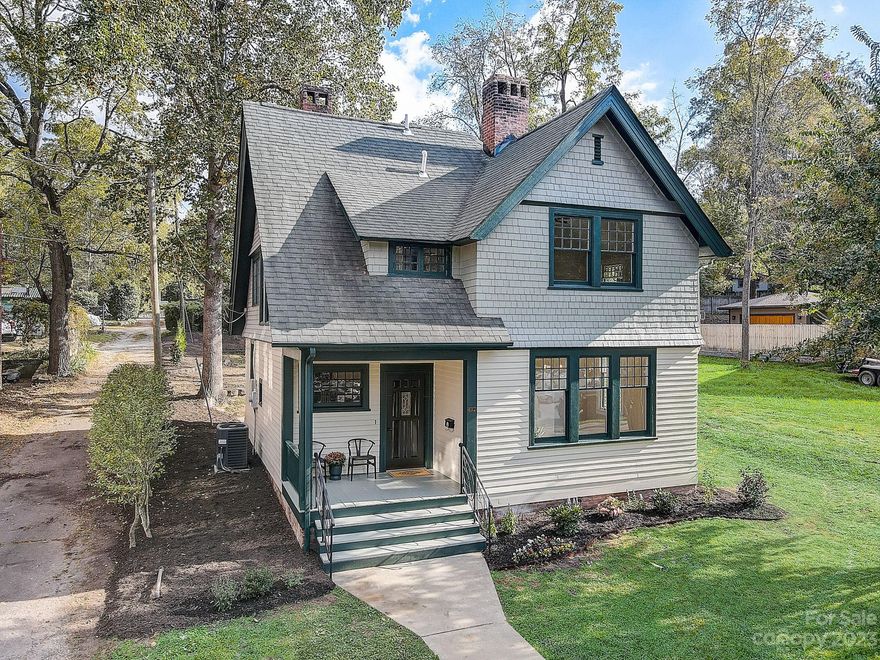 Charming Craftsman Cottage is located in the historic Montford District and is walkable to downtown Asheville. The home has been completely refreshed including new paint, refinished original floors/doors/trim, & modern appliances including a tankless H20 heater, & gas range. The stunning double-sided staircase will be a conversation starter. The main level features a living room, parlor/den, or dining room. The kitchen is ample in size w/ a cute nook perfect for a pantry. A main level laundry room is just off the kitchen area. A bright & sunny main bath with a garden tub. The upper level features 3 good-sized bedrooms, a full bath w/walk in tile shower, & a linen nook. The 3rd bedroom has a ladder to a finished/conditioned loft space. The lot is approved for an additional dwelling/garage with an apartment, there is off-street parking behind the home, & a storage shed. You will love the covered front porch! This home is updated but has maintained all of its historical charm.