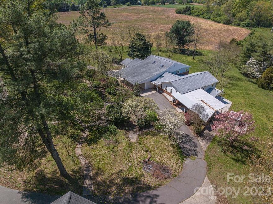 This property offers over 4000 square feet of heated living space on almost 3 acres located just west of Lincolnton!  This 5 bedroom 3 bath home offers room galore and 500+ square feet that is finished, but not heated/cooled offering additional living area.  The main level offers a gigantic great room with plenty of cabinets in the kitchen for storage all connected to the roomy living room with high ceilings that is a great entertaining space.  The Primary Suite offers his and her closets w/barn doors, library area, bath with dual vanities and counter space to spread out.  The upper level offers 2 bedrooms & a bath.  The lower level offers an outside entrance w/Rec Area, 2 bedrooms and bath.  Plenty of covered patio area for outdoor entertaining.  2 car attached carport + a 4 car detached garage for the auto storage or a great workshop.  There is so much to see here, so come take a look!