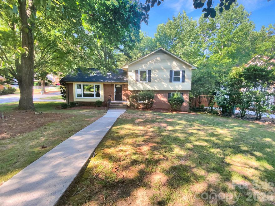 Welcome to this stunning property, where every detail has been thoughtfully considered. The home boasts a brand new roof and a neutral paint scheme, providing a serene and calming atmosphere and the perfect canvas for your personal touches. The kitchen is a chef's dream, complete with all stainless steel appliances, sleek counters, an accent backsplash, and a center island for additional counter space. Retreat to the primary bathroom, where double sinks offer ample room for morning routines. Enjoy outdoor living with a spacious deck and patio, perfect for entertaining or simply relaxing. As the days get cooler, cozy up next to the warm fireplace. This property is a must-see, combining style, comfort and luxury in one package.