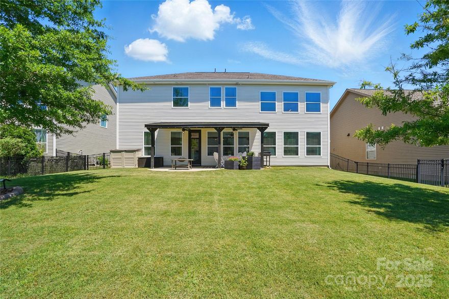 Step into elegance in this beautifully designed 5-bedroom home in Kings Grove. The inviting foyer is flanked by a flex space (perfect for living or formal dining) & executive office w/French doors. You'll love the soaring ceilings, rich moldings, & upgraded fixtures that exude quality & style. Designed for modern living, the open-concept great room & kitchen are bathed in natural light, creating a warm & inviting atmosphere. Unleash your inner chef in the amazing kitchen, boasting SS appliances, large island, & walk-in pantry. A private bedroom suite on the main level is perfect for guests or 2nd home office. Upstairs features a generous loft—perfect for lounging or play—alongside three bedrooms, laundry room, and a primary suite that serves as a private, luxurious retreat.  Relax on the covered back porch, entertain and grill in the large, fenced backyard, or cool off with a dip in the nearby community pool. Clover Schools and Convenient to shopping, dining & Lake Wylie.