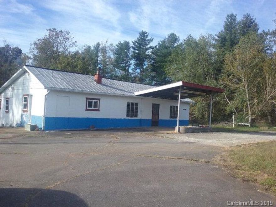 Located on 226 South.  This home was originally a gas station. It now has a great room, three bedrooms, one and a half baths, large kitchen  and unfinished basement. Sits on approximately 4.22 acres.  Needs work!  Being sold As-Is... Lot's of possibilities for this property.