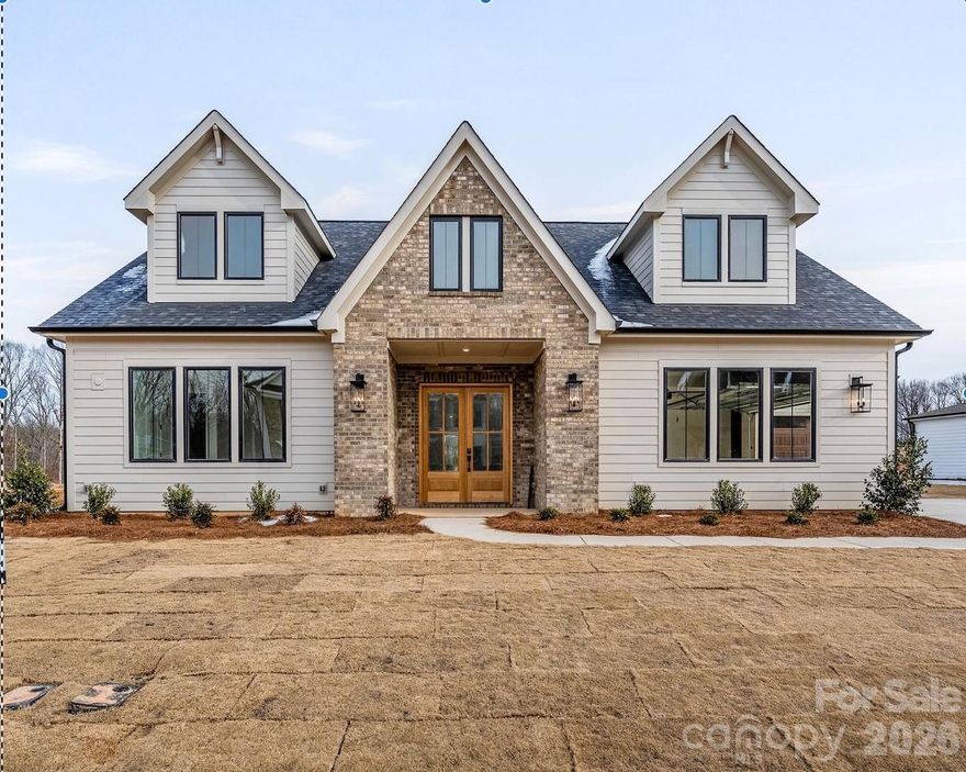 Unwind in luxury with this exquisite 3,665-square-foot home. The expansive primary suite, located on the main level, features a spa-inspired bathroom w/ a luxurious floating tub & an oversized dual-head shower + rain head. The main floor also houses a well-appointed secondary bedroom. Additionally, a versatile office space on the main level ensures that working from home has never been more stylish. This home features an open floor plan, seamlessly connecting the living areas. A chef's kitchen, equipped with top appliances and a generous island. A scullery/pantry with sink, dishwasher and beverage fridge makes hosting a breeze. Upstairs, 2 spacious bedrooms with walk-in closets offer ample storage. Entertaining extends outdoors with a covered patio w/fireplace, ideal for alfresco dining or relaxation. With easy access to Wesley Chapel's vibrant hub of shopping and dining, this home truly represents the pinnacle of affordable modern luxury living. Tour our model and design center & ask about our great lending partner incentive!