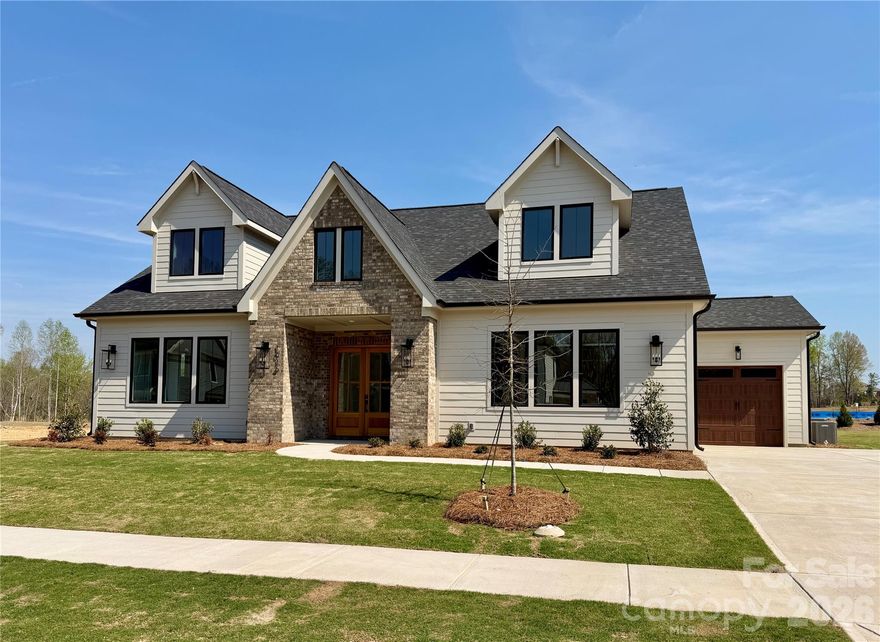 Unwind in luxury with this exquisite 3,665-square-foot home. The expansive primary suite, located on the main level, features a spa-inspired bathroom w/ a luxurious floating tub & an oversized dual-head shower + rain head. The main floor also houses a well-appointed secondary bedroom. Additionally, a versatile office space on the main level ensures that working from home has never been more stylish. This home features an open floor plan, seamlessly connecting the living areas. A chef's kitchen, equipped with top appliances and a generous island. A scullery/pantry with sink, dishwasher and beverage fridge makes hosting a breeze. Upstairs, 2 spacious bedrooms with walk-in closets offer ample storage. Entertaining extends outdoors with a covered patio w/fireplace, ideal for alfresco dining or relaxation. With easy access to Wesley Chapel's vibrant hub of shopping and dining, this home truly represents the pinnacle of affordable modern luxury living. Tour our model and design center & ask about our great lending partner incentive!