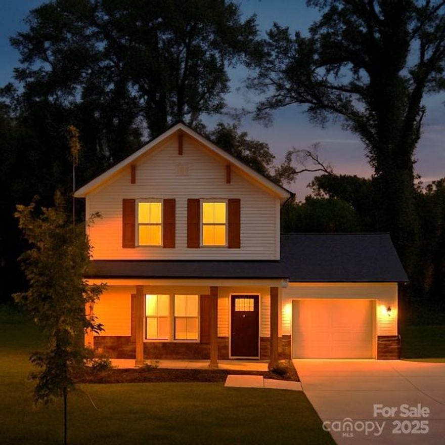 New Construction with Modern Farmhouse Style! Open and inviting, this home features LVP flooring throughout the main level and a bright white kitchen with quartz countertops, pantry, and plenty of recessed lighting. The huge living room is perfect for gatherings. Relax in the spacious primary suite with walk-in closet and a sleek bathroom with quartz, LVP flooring, and black hardware. Guest bedrooms are generous with double closets. Enjoy the rocking-chair front porch, back patio, 1-car garage, large driveway, and charming wooden shutters with stone wainscoting—style and functionality all in one!