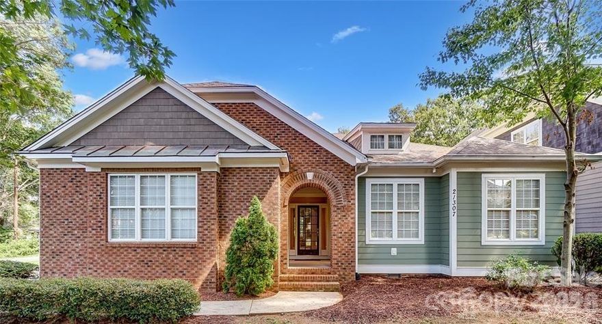 If a meticulously maintained home is what you’re after, this is it! This exceptional single-level home with a finished room over the garage, crafted by ES Johnson Builders, is located in the highly sought-after Island Forest waterfront community on Lake Norman. Positioned on a desirable corner lot with seasonal peek water views, the home offers timeless craftsmanship, coveted lake access, and a thoughtfully designed layout blending comfort and sophistication. The residence features 3-bedrooms and 3-bathrooms, including dual primary suites on the main level, each with a private en suite bath, ideal for guests or multigenerational living. Architectural highlights include a welcoming covered entry, craftsman-style moldings, custom built-ins, solid oak flooring, tall ceilings, and rich maple cabinetry. The open, flowing floorplan provides abundant storage and effortless everyday living, while a fully screened back porch extends the living space outdoors. The upper level offers a versatile bedroom or oversized bonus room with a newly built full bath, perfect for guests, a home office, or recreation space. Thoughtful updates offer peace of mind, including a Trane HVAC system (2019), new roof (2022), tankless water heater (2022), hardwood flooring replacing carpet (2022), fresh exterior paint (2024), and crawlspace encapsulation (2025). Island Forest offers a community dock, boat launch & picnic area located off Montcalm & Island Forest Drive, providing easy access to the Lake Norman lifestyle. Ideally situated just five minutes from grocery stores, dining, coffee shops, and I-77 in desirable Cornelius, this home is truly move-in ready.