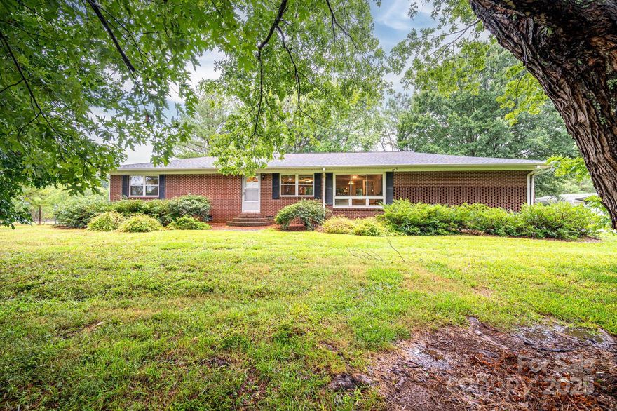 Welcome to 270 Tirzah Rd, nestled in the scenic countryside of York, SC. Set on just under 4 acres of mature, landscaped land, this mini-farm or homestead offers a peaceful retreat. The main home features nearly 2,000 sq ft with 3 bedrooms, 2 baths, a screened all-season sunroom, an unfinished partial basement, and a fenced-in backyard—perfect for pets or play. A private 750 sq ft guest house shares the drive, complete with its own kitchen, living room, screened porch, bedroom, and bath—ideal for extended family or rental income. The property also includes a run-in shed, open pasture, and a two-bay workshop. With one well and separate septic systems for each home, this property blends comfort with self-sufficiency. Don’t miss this unique opportunity to own a serene slice of York’s farm and pasture community.  Fully interactive Virtual tour link included in the MLS.