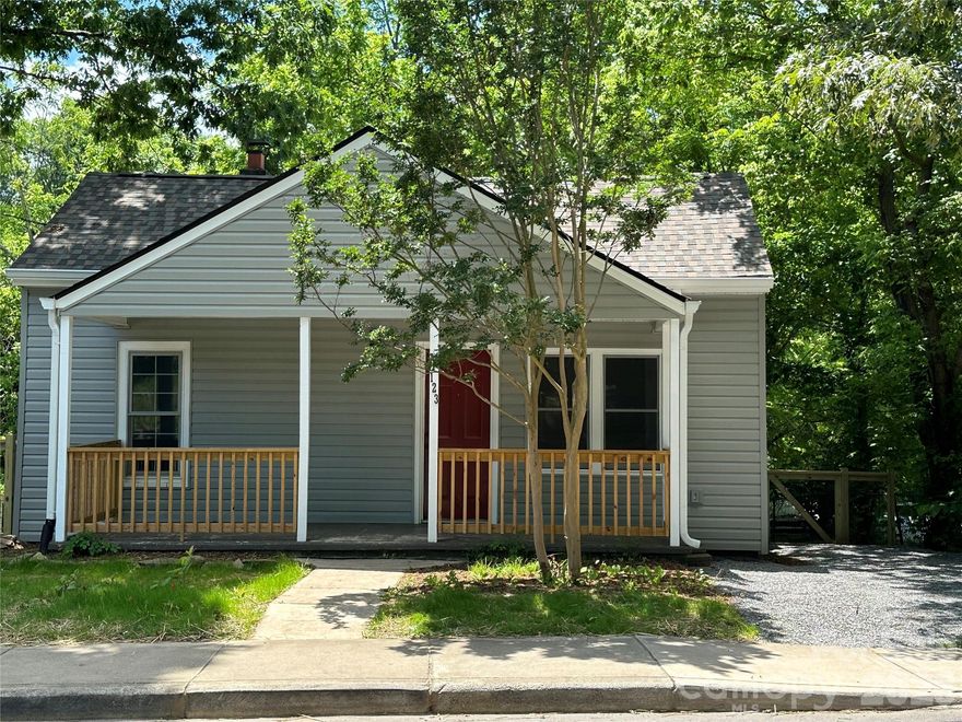 Don't miss this 2 bedroom 2 bath split floor plan.  Large living room with nice size closet.  Bedrooms and living room have beautiful refinished hardwood floors.  Spacious "eat in" kitchen with laundry closet.  The kitchen and baths have tile floors.  Go from the kitchen to a large deck which looks out over fenced yard. There is a rocking chair front porch where you can enjoy the West Asheville "vibes".  What we have is an old charming cottage with lots or updates. You can walk from Sunny Point Cafe to Carrier Park.
